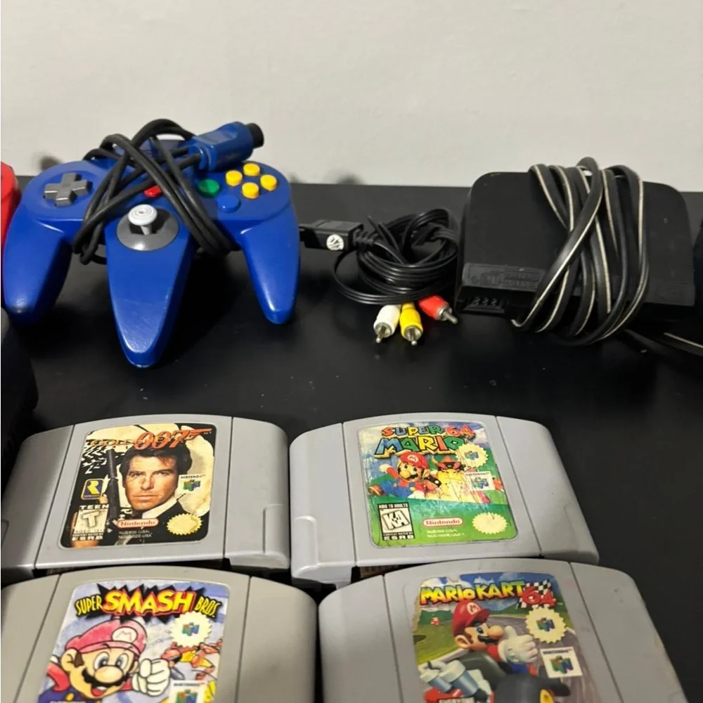 Nintendo Gray Console with Controllers and Game Cartridges